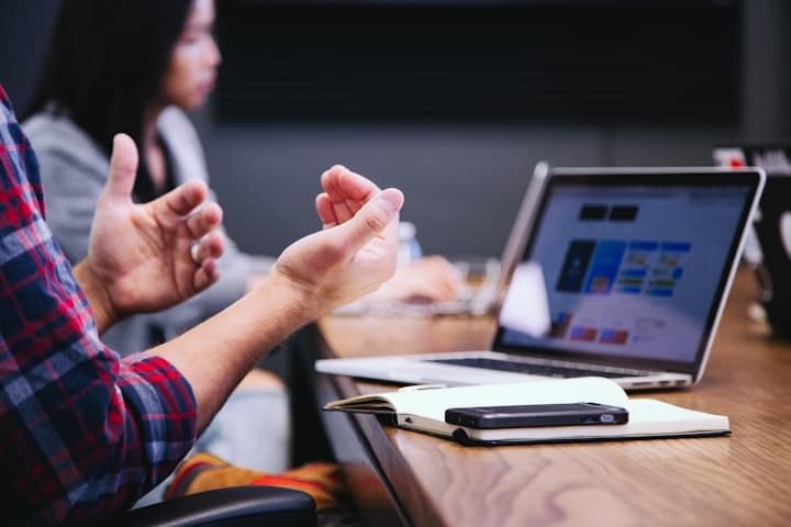 Hands typing on a laptop at home, working through finances calmly